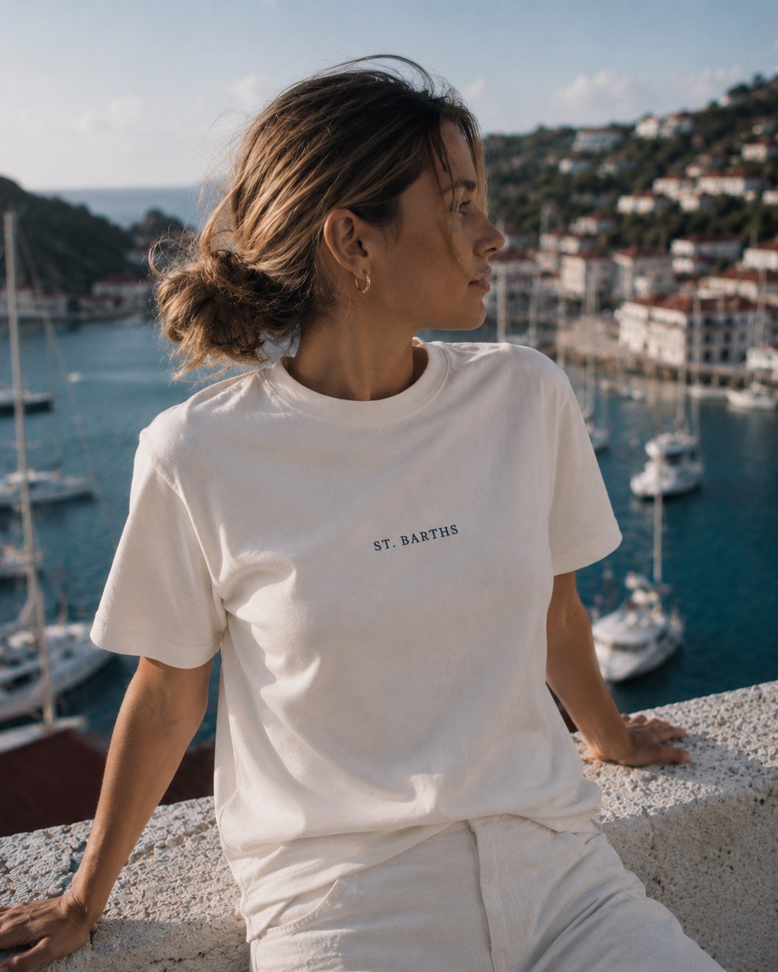 Above Gustavia harbor, in the white tee